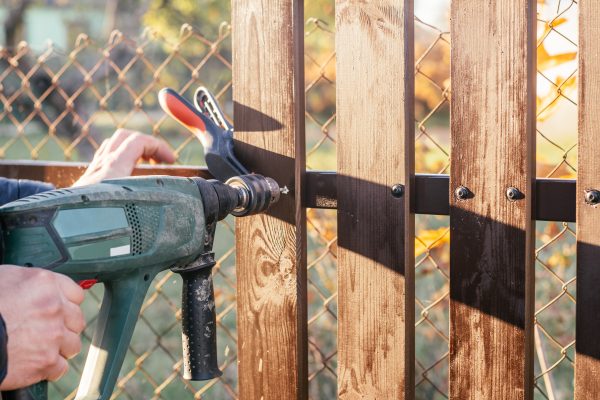 hand-of-carpenter-holding-electric-drill-for-makin-2026-01-08-07-43-11-utc