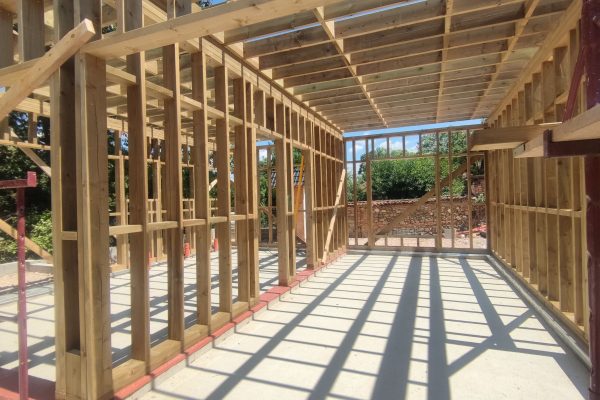 The wooden structure of a building under the sunlight -construction site